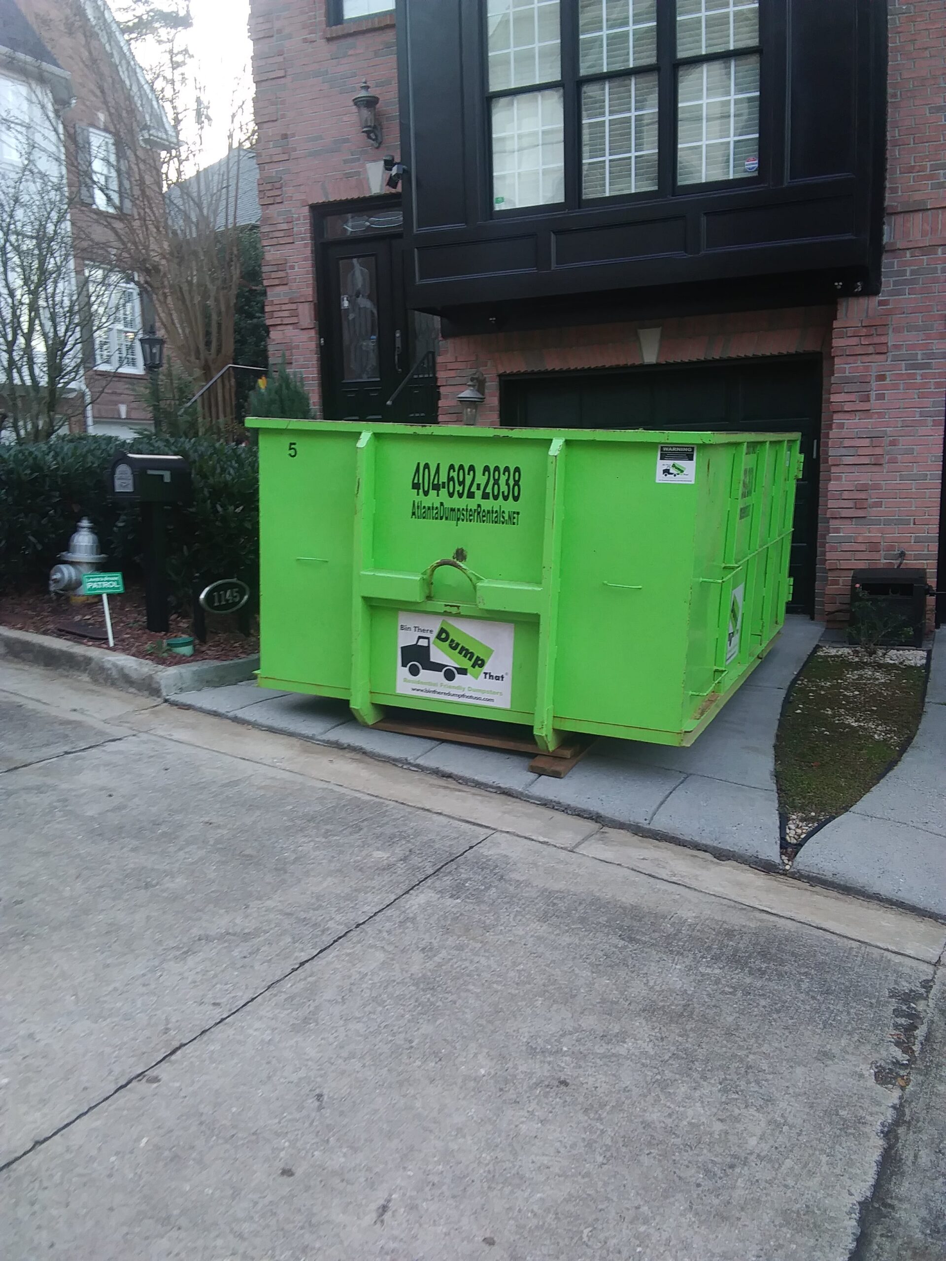 Dumpster in front of house